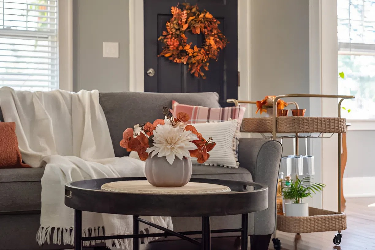 Freshly painted gray living room walls with warm fall décor accent painted by a painter in Plainwell, MI