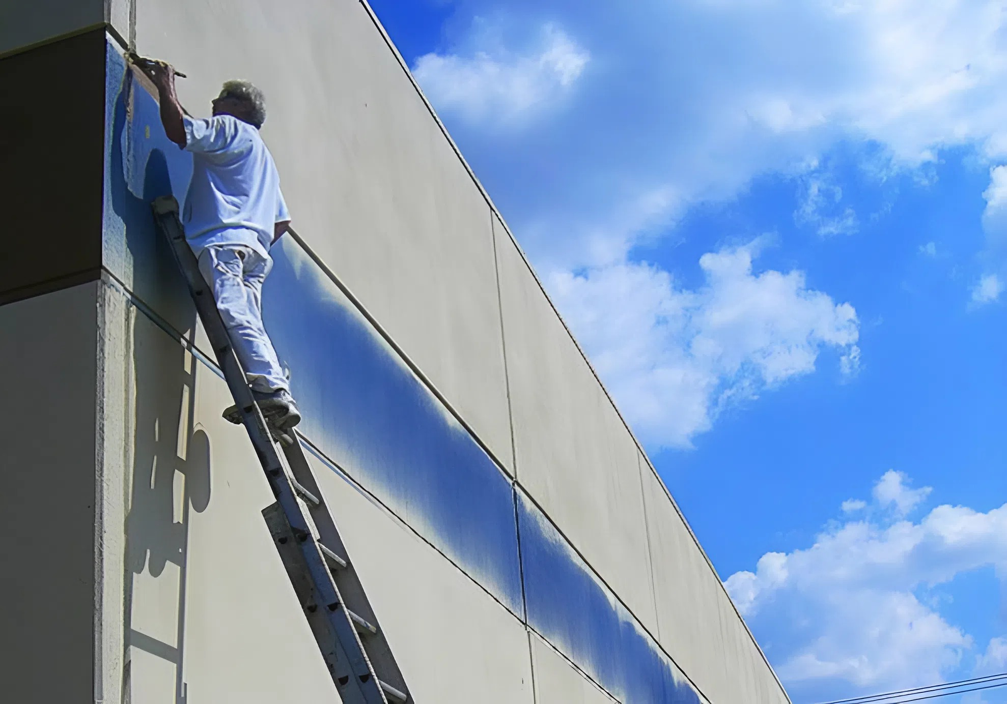 Commercial exterior painting on a building by a painter in Portage, MI