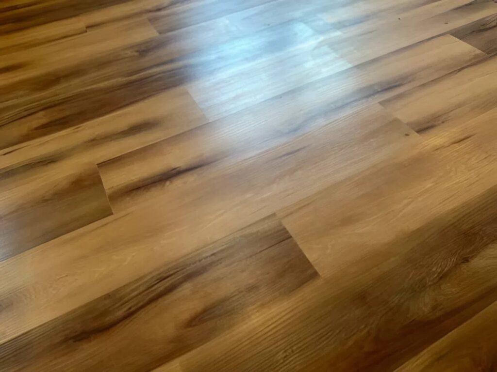 Smooth, finished plank flooring with natural wood grain and seamless installation by a painting company in Galesburg, MI