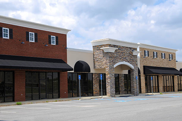 Modern storefront with fresh neutral exterior paint and stone accents by an exterior painter in Kalamazoo, MI