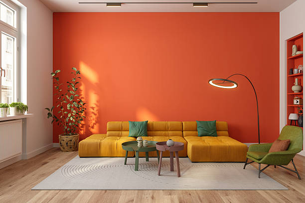 Bold orange accent wall painting with smooth modern finishes by an interior painter in Plainwell, MI.